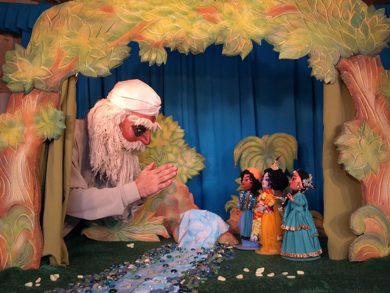 A sage character on the puppet stage