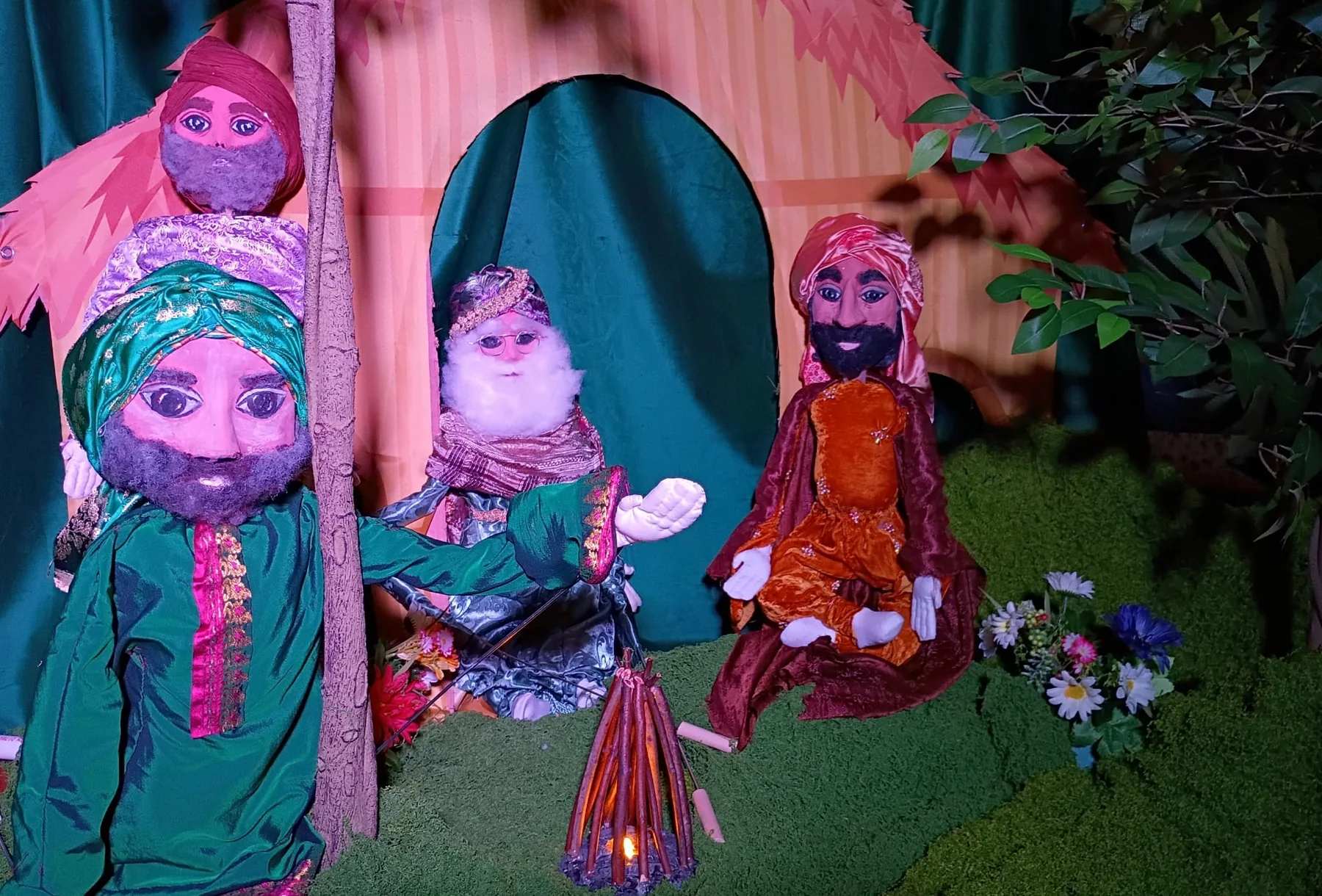 Puppet characters gathered in a village scene